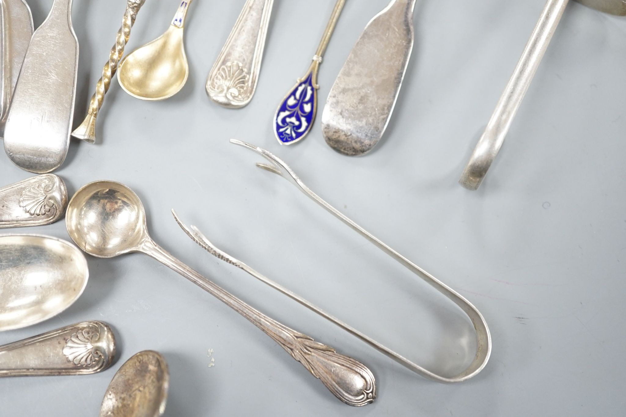 A set of twelve Victorian silver fiddle pattern teaspoons, London, 1870, a pair of Victorian sauce lades and a quantity of assorted sundry silver flatware